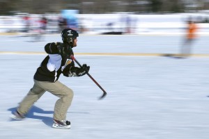 pan motion photograph of skater playing pond hockey by Jamie McCaffrey https://flic.kr/p/jTxCLs