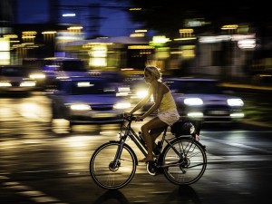 pan motion photography of “Woman on Bike in front of Cars” by Sascha Kohlmann https://flic.kr/p/orvq8H