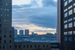 photograph of new york cityscape framed by skyscraper buildings by Steven Pisano https://flic.kr/p/r8a7SJ