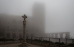 cityscape photograph of cross sculpture in fog by Andrew Moore https://flic.kr/p/o6BvV9